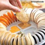 Orange and grey microwave chip maker tray with sliced potatoes and mandolin