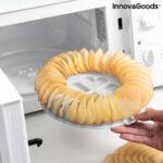 Orange and grey microwave chip maker tray with sliced potatoes and mandolin