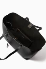 Saint Laurent East/West black leather tote bag with gold YSL charm and detachable pouch.