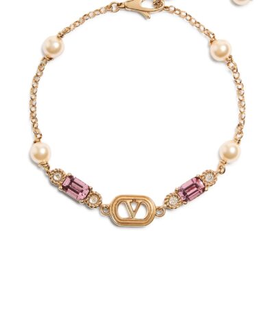 Valentino Garavani Ovalette bracelet in gold-finish metal with pearls and Swarovski crystals.