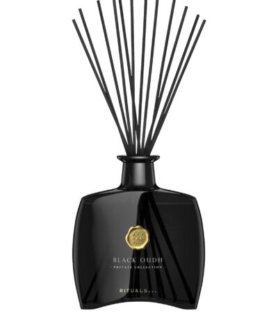 The Ritual of Oudh Fragrance Sticks in a luxury black glass bottle.