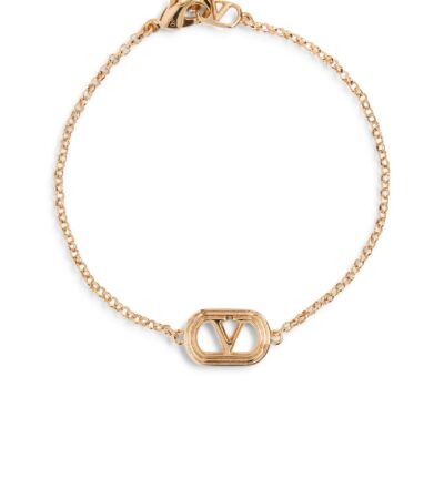 Valentino Garavani Ovalette gold-tone bracelet featuring a Swarovski pearl and VLogo emblem.