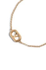 Valentino Garavani Ovalette gold-tone bracelet featuring a Swarovski pearl and VLogo emblem.