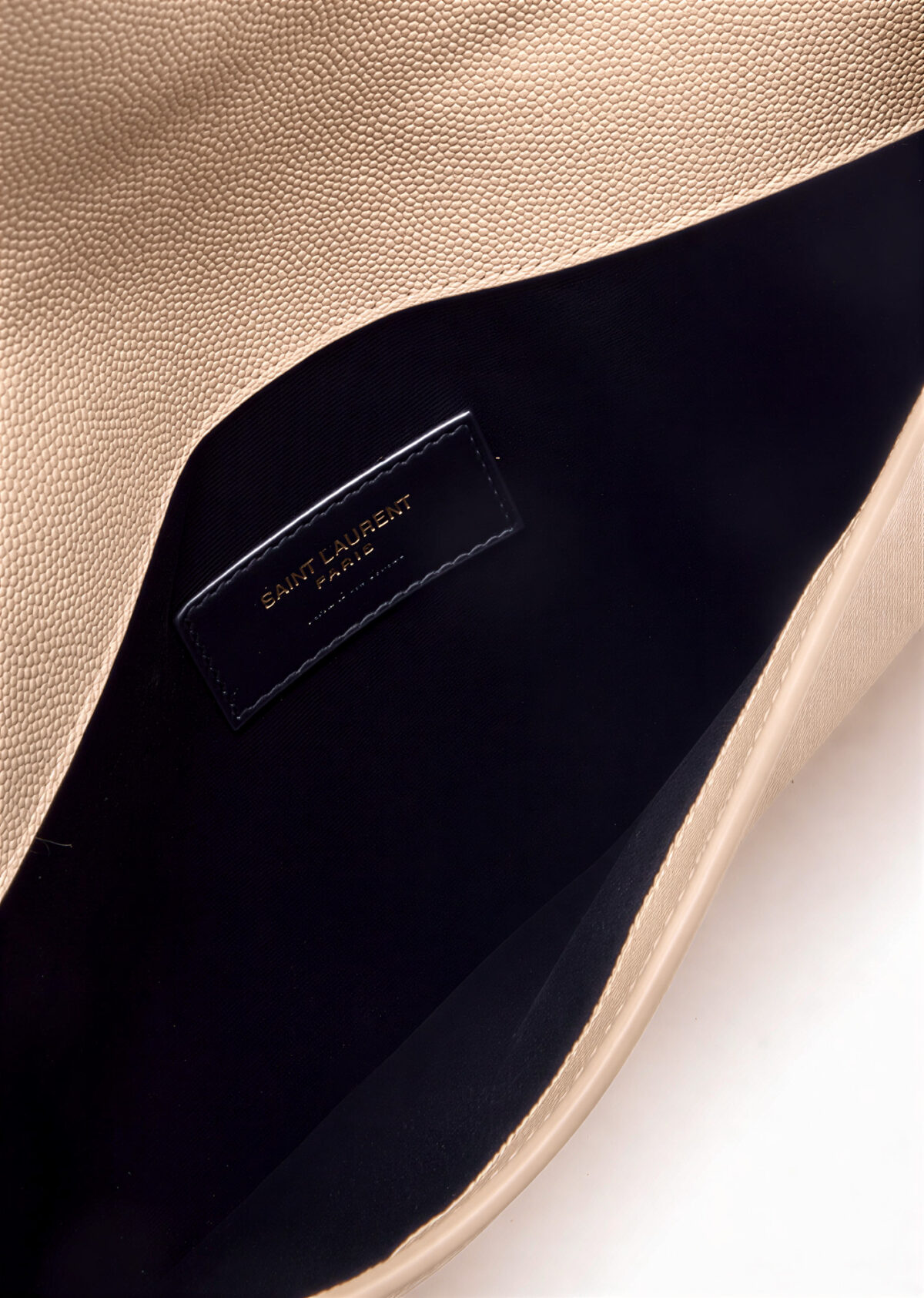 Front view of Saint Laurent Uptown Pouch in black grained leather with gold YSL logo.