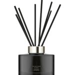 Dark glass Jo Malone London Velvet Rose & Oud diffuser with 10 rattan reeds.
