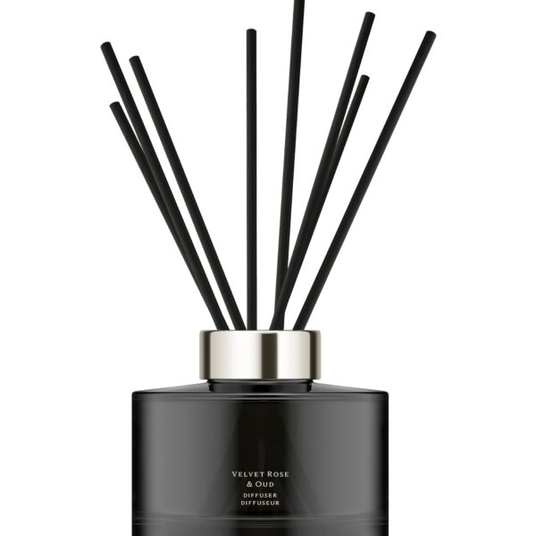 Dark glass Jo Malone London Velvet Rose & Oud diffuser with 10 rattan reeds.
