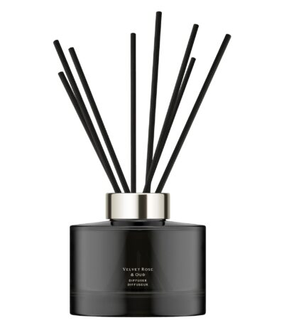 Dark glass Jo Malone London Velvet Rose & Oud diffuser with 10 rattan reeds.