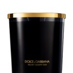 A luxury black glass candle featuring the Dolce & Gabbana Velvet Desert Oud label, presented in a velvet box.
