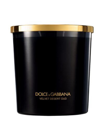 A luxury black glass candle featuring the Dolce & Gabbana Velvet Desert Oud label, presented in a velvet box.