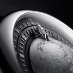 CIGA Design Moon Walker watch featuring a micro-engraved lunar surface dial and a miniature astronaut hand.