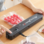 Black automatic vacuum sealer machine for food preservation with sealing bags