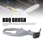 Stainless steel barbeque grill steam brush cleaning a black outdoor grill grate.