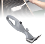 Stainless steel barbeque grill steam brush cleaning a black outdoor grill grate.