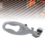 Stainless steel barbeque grill steam brush cleaning a black outdoor grill grate.