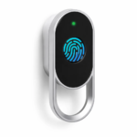 A sleek silver and black smart lock installed on a wooden office drawer.