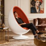 Modern upholstered fiberglass egg chair with tufted back for luxury interiors