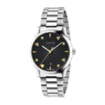 Gucci G-Timeless 38mm men's watch with black dial featuring bee and star motifs on a stainless steel bracelet.