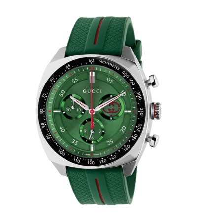 Men's Gucci Interlocking watch with green dial and green rubber strap.