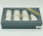 Set of 12 traditional white Arabic coffee cups arranged on a serving tray