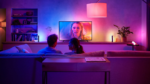 Philips Hue Play Gradient Lightstrip mounted on the back of a 75-inch television