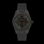 Front view of Emporio Armani silver skeleton watch with amber crystal and stainless steel bracelet.