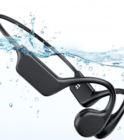 Swimmer wearing black bone conduction headphones with goggles in a pool