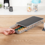 Black metal coffee capsule drawer holding 40 Nespresso pods