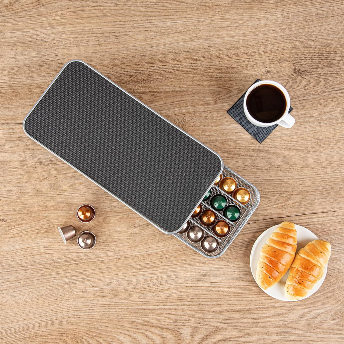 Black metal coffee capsule drawer holding 40 Nespresso pods