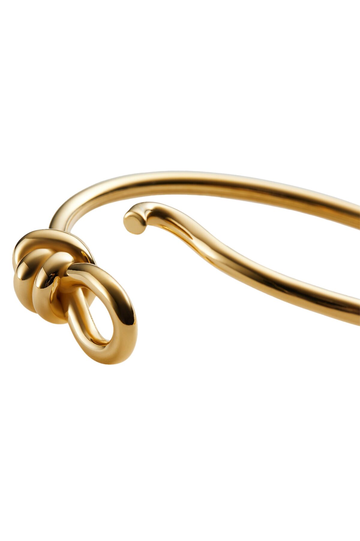 Close-up of the Bottega Veneta Knot Bracelet featuring the gold knot motif that is its signature.