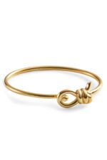 Close-up of the Bottega Veneta Knot Bracelet featuring the gold knot motif that is its signature.