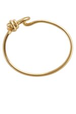 Close-up of the Bottega Veneta Knot Bracelet featuring the gold knot motif that is its signature.