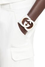 Front view of the Gucci Interlocking Cuff Bracelet featuring the white resin G motif.