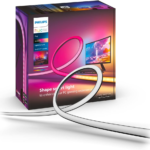 Philips Hue Play Gradient Lightstrip mounted on a 27-inch PC monitor showing colorful RGB backlighting.