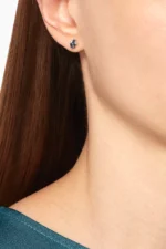 Suzanne Kalan 18K white gold earrings with dark blue sapphire baguettes and diamonds.