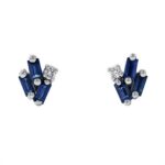 Suzanne Kalan 18K white gold earrings with dark blue sapphire baguettes and diamonds.